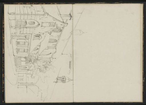 House next to a church on a street