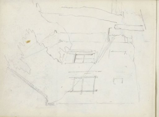 House with a gabled roof and a tree