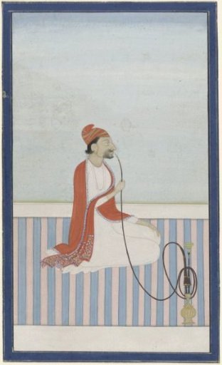 Seated Radja smoking a hookah