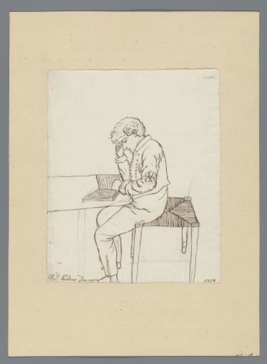 Boy Reading at a Table