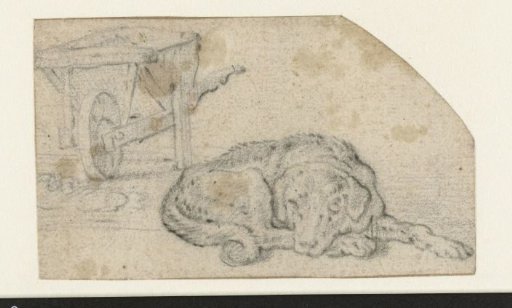 Reclining Dog near a Wheelbarrow