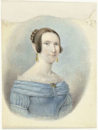 Woman in a blue jacket, with gold earrings