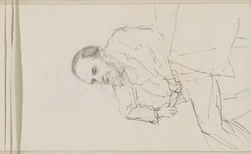Portrait of a bearded man sitting at a table