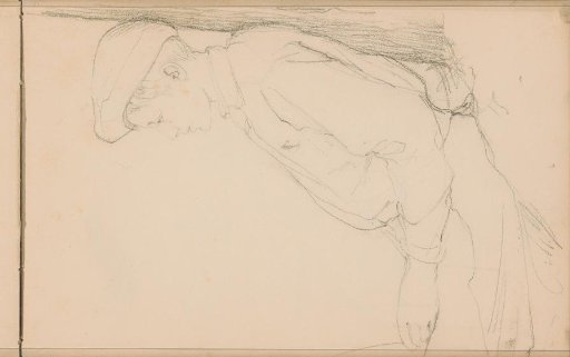 Boy with a cap sitting against a tree