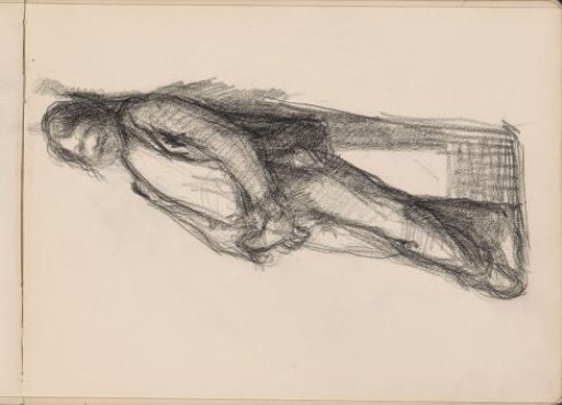 Man leaning against a wall, legs crossed