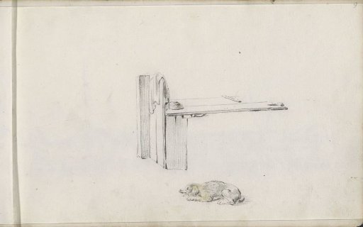 Reclining dog and a wooden table or workbench