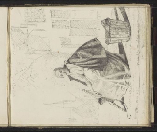 Seated woman in a village street