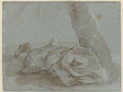 Man Lying on His Stomach with a Hat