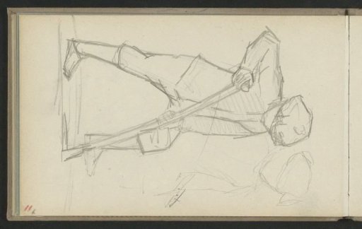 Man with his left leg on a shovel