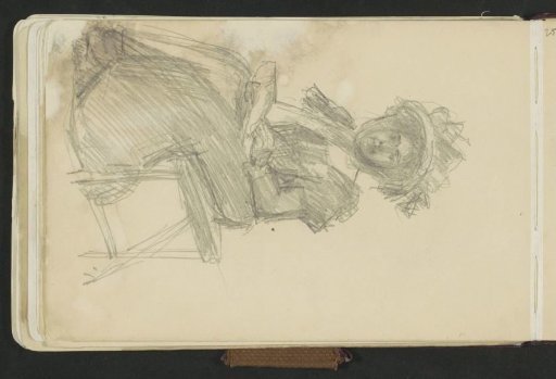 Woman sitting on a stool with a book
