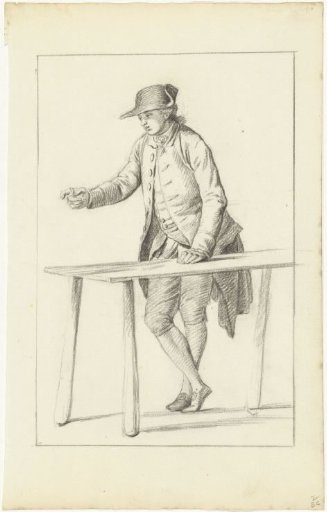Standing, pointing man at table