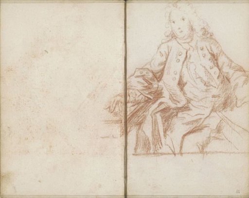 Seated man beside a table