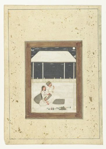 Seated couple on a terrace