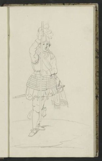Soldier Holding a Spear Upright with Both Hands in Front of Him Above the Ground