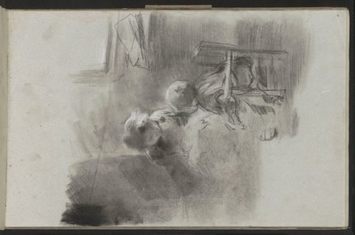 Girl kneeling beside a child on a low chair