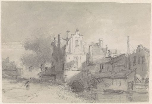 View of buildings along a canal on the edge of the city
