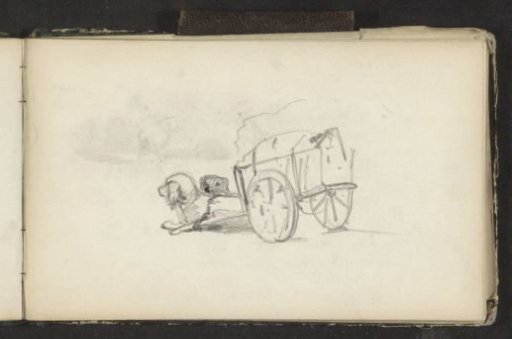 Two dogs lying in front of a handcart