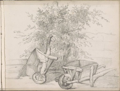 Upright and overturned wheelbarrow against a wall