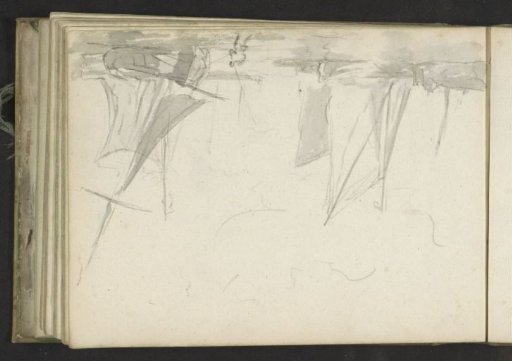 Man pulling a sailing boat ashore on a coast