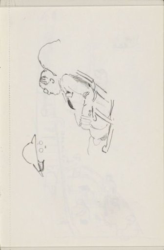 Man with glasses sitting in an armchair