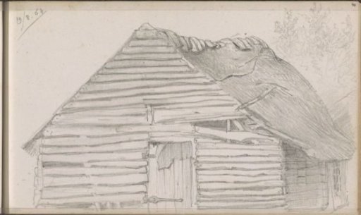 Wooden barn with a thatched roof