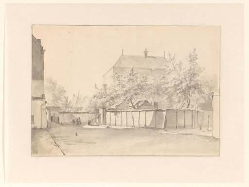 City view with a tall house surrounded by a stone wall