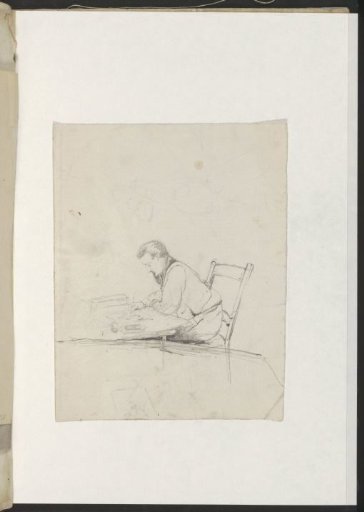 Man drawing at a table