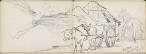 Ox cart near a barn and a hay bale