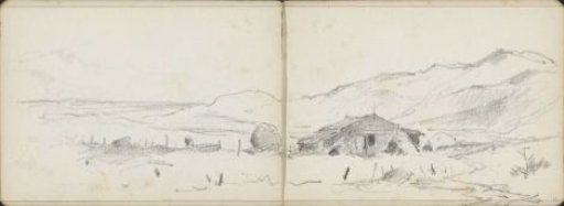 Hilly landscape with a barn and hay bales