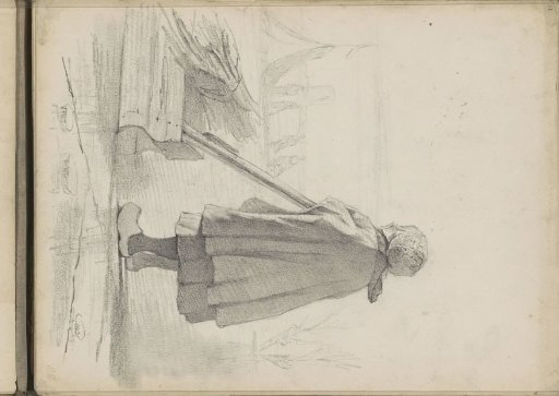 Girl with a sled with twigs on the ice