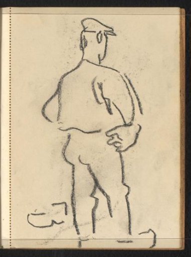 Standing man with headgear and clogs seen from the side from behind