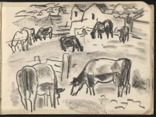 Grazing cows with four houses in the background