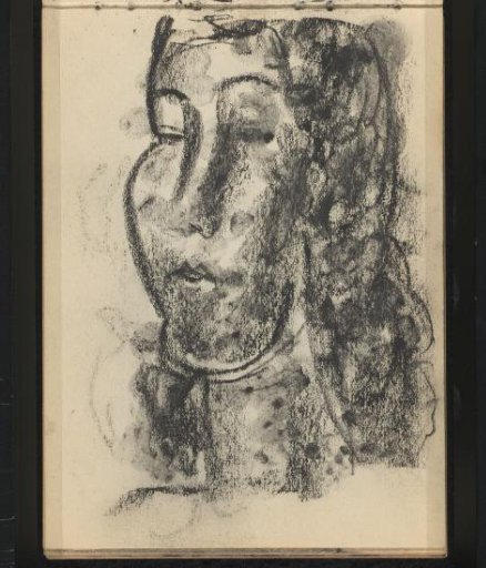 Woman with dark hair and a long face