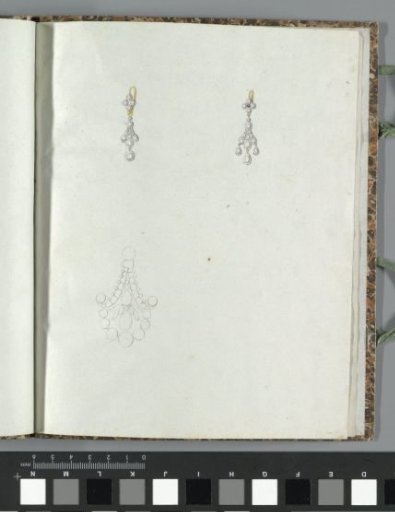 Two earrings and an unfinished drawing
