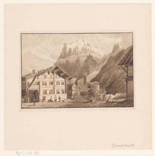 View of the village of Grindelwald with a glacier in the distance