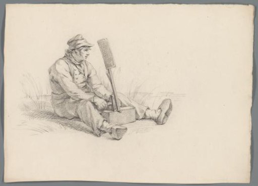 Man Working a Block with a Hammer