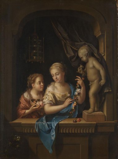 Two girls with flowers near a statue of Cupid