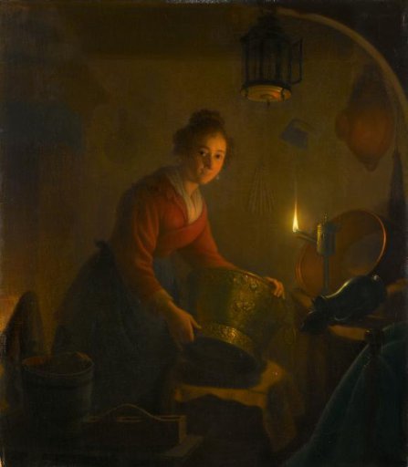 A Woman in a Kitchen by Candlelight