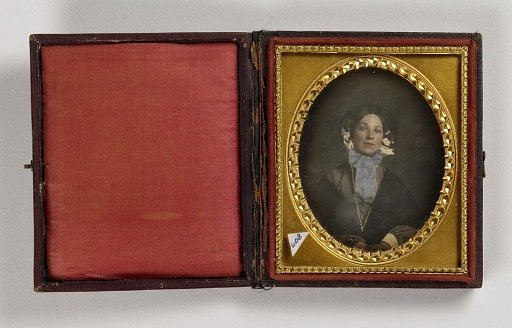 Woman Wearing Bonnet with Blue Bow
