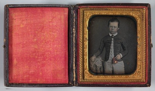 Untitled (Boy Holding a Red Case)