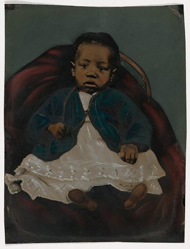 [Infant on Red Chair]